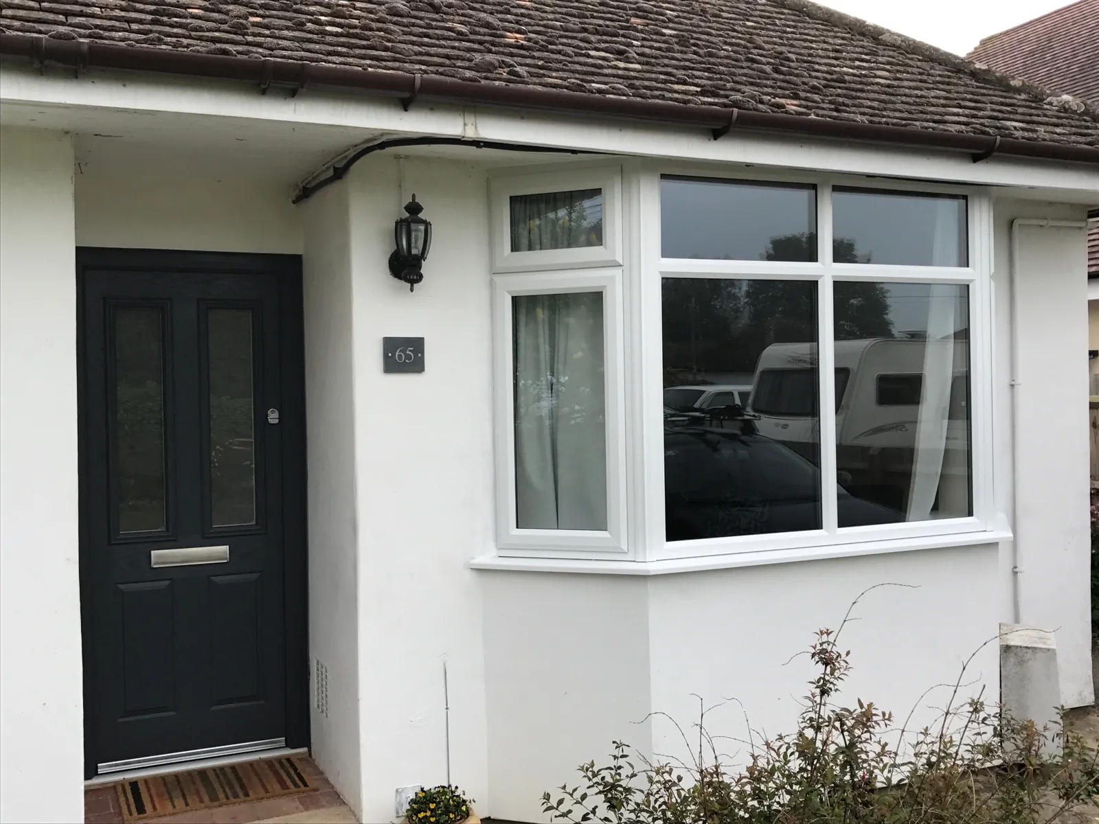 White uPVC bay windows on a bungalow